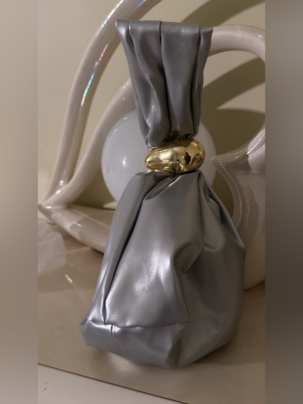 A Classy Chic Boutique Silver Mini Knot Bag with Gold Accent